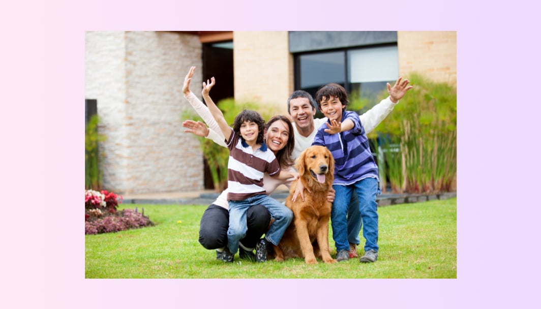A family with a dog, looking happy in their lawn. Representing the topic, "Australian Government 20% Deposit Scheme".