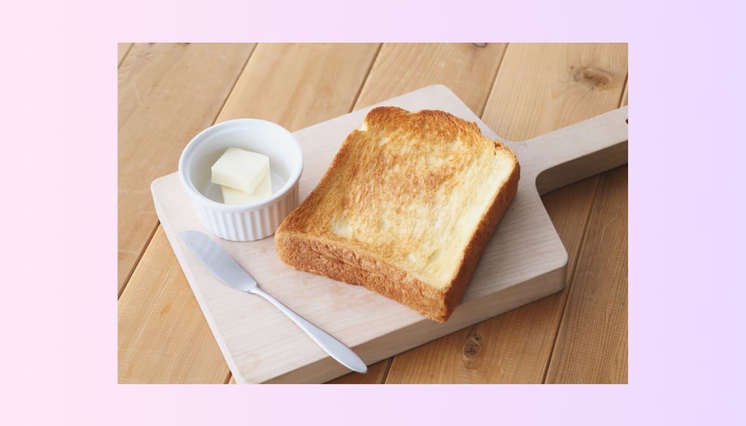 An image of a toast and butter, representing inflation for the overall topic, why buying a house feel harder.